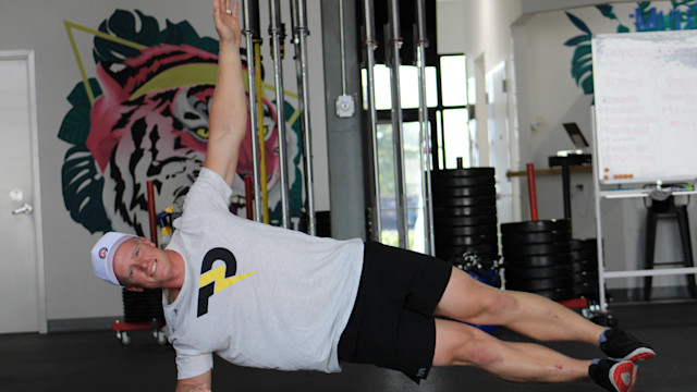 Thor Parrish, PGA, demonstrates a side plank.